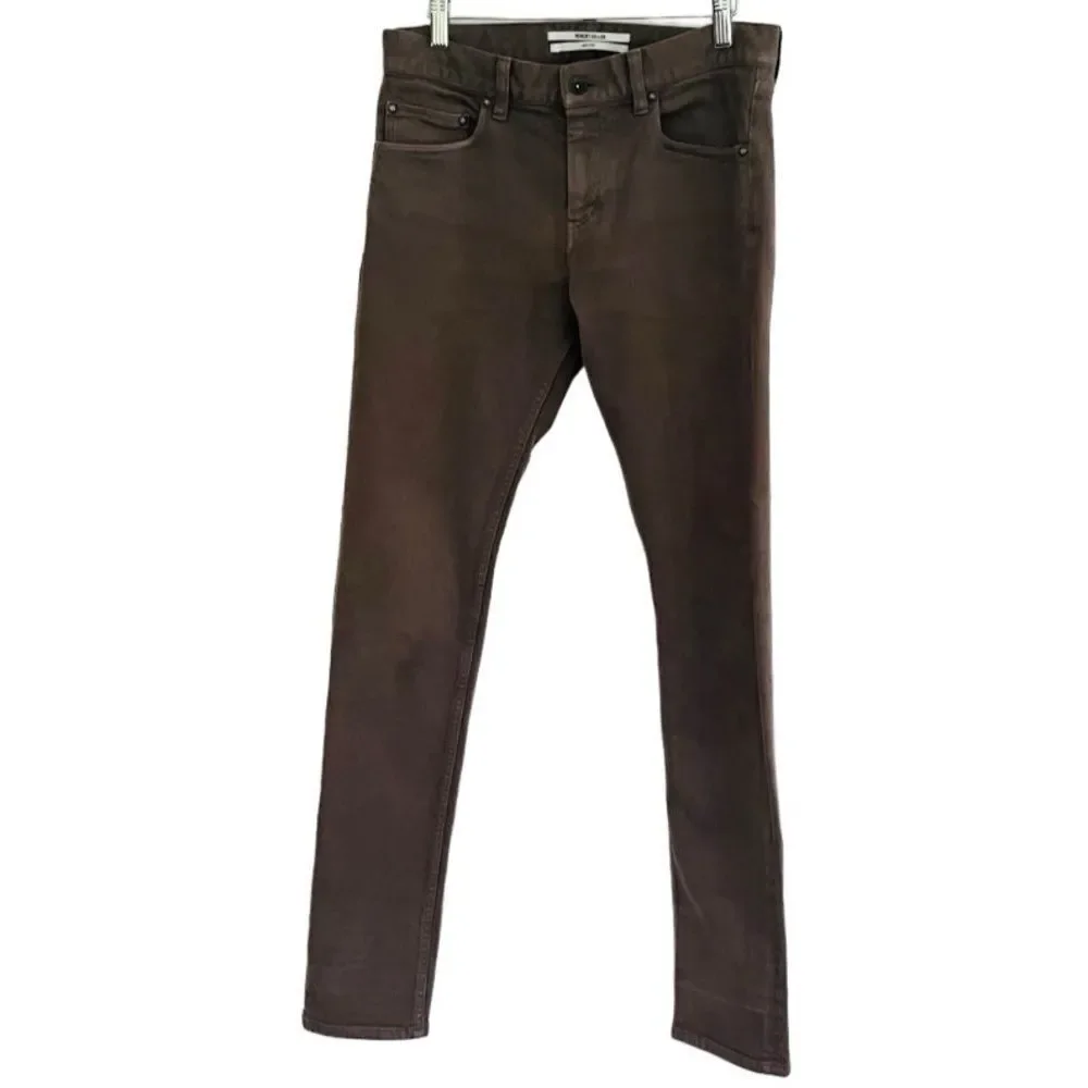 Robert Geller slim fit 5 pocket olive green jeans.